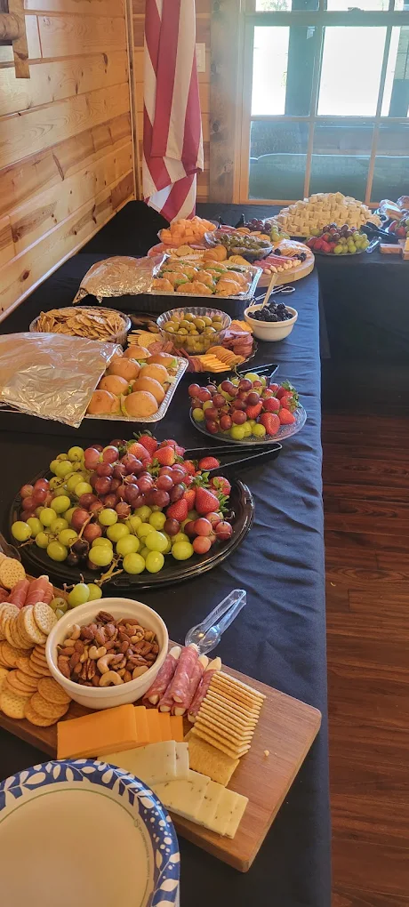 Catering table with fruit, cheese and pastry trays for an event in Lead, SD